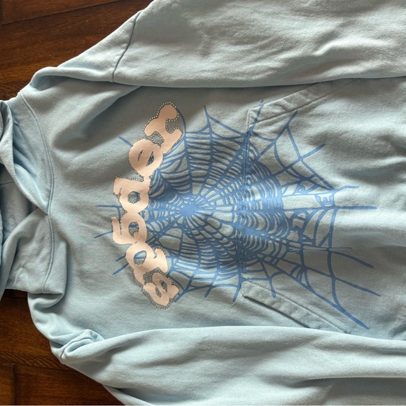 sky blue spider hoodie with rhym stones